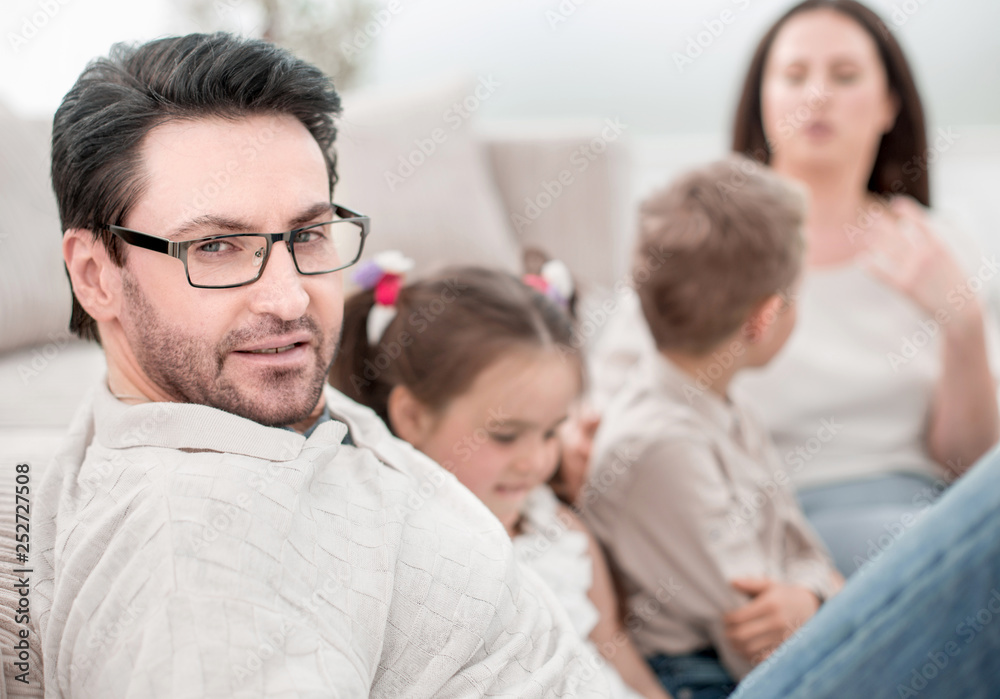 close up.parents play with their children sitting on the couch close up.parents play with their children sitting on the couch