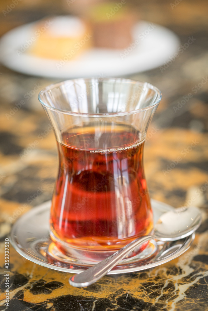 traditional Turkish red black tea tulip glass green flowers sweet dessert afternoon tea break