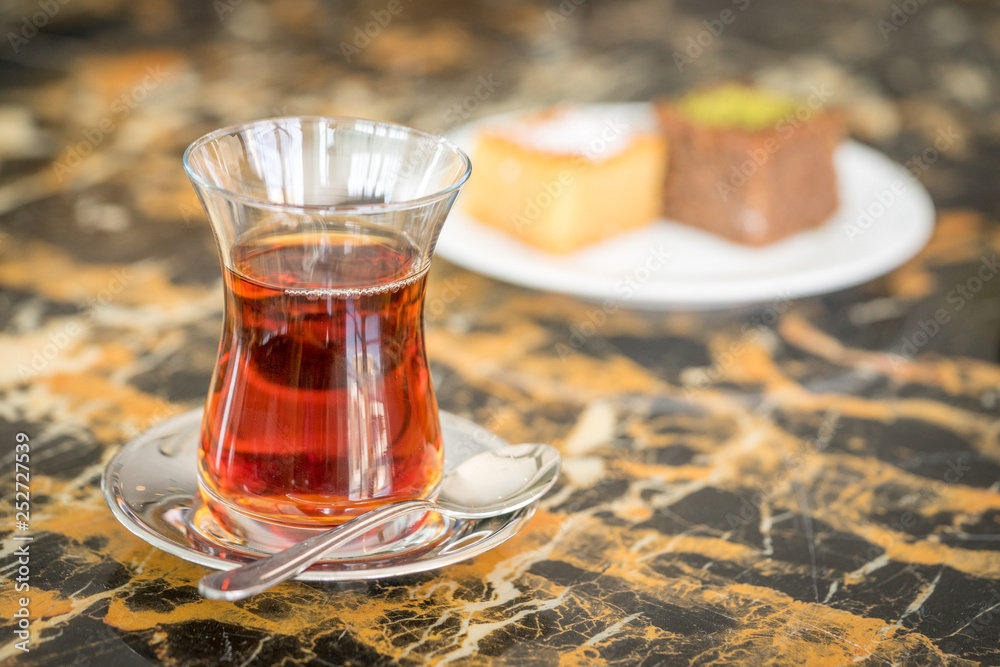 traditional Turkish red black tea tulip glass green flowers sweet dessert afternoon tea break