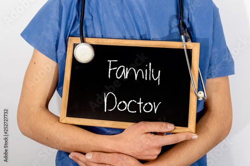 Doctor shows information on blackboard: family doctor.  Medical concept.