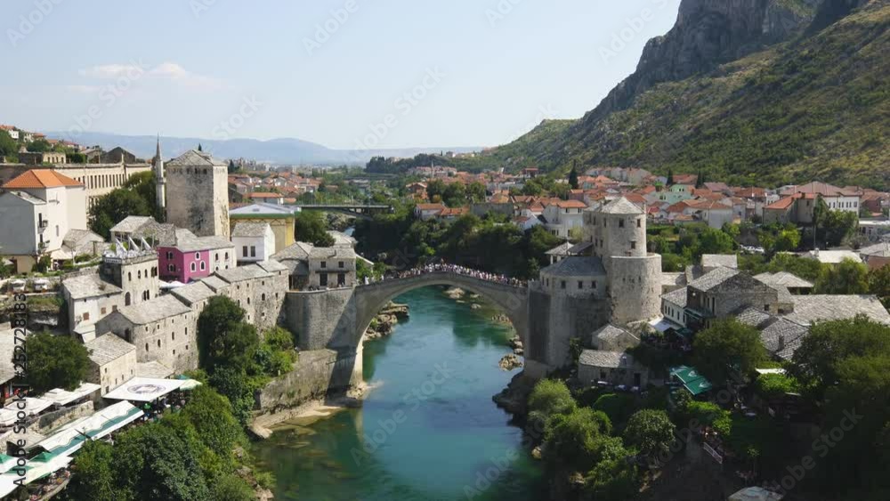Panorama of The Old Bridge in Mostar in a beautiful summer day, Bosnia and Herzegovina Panorama of The Old Bridge in Mostar in a beautiful summer day, Bosnia and Herzegovina