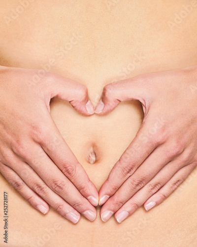 Wallpaper Mural Stomach care healthy gut health probiotics hands in heart shape touching belly button for pregnancy, diet, digestion healthcare concept. Torontodigital.ca