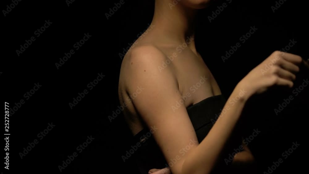 Female stroking her body with hundred dollar banknote, prostitute in bawdy house Female stroking her body with hundred dollar banknote, prostitute in bawdy house
