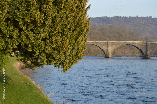 Telford's bridge across the river at Dunkeld, Pershire in late Februay sunshine viewed from Cathedral grounds photo