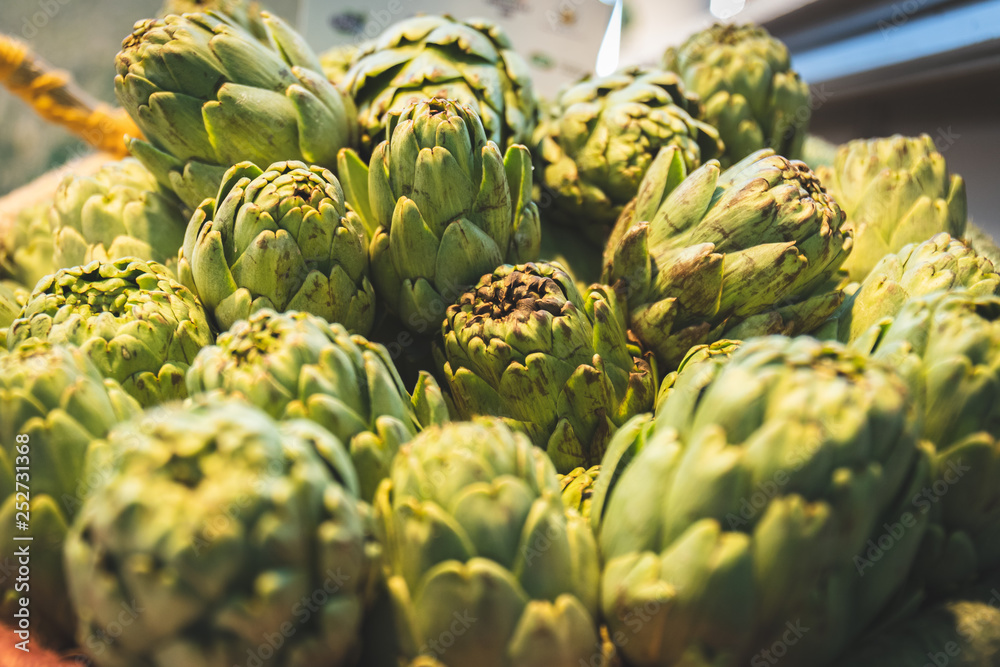 Fototapeta premium Artichokes fresh and delicious artichokes ready to be cooked in the kitchen for lunch or dinner