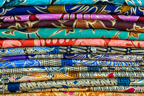 Assortment of colorful sarongs for sale in local market, Island Bali, Ubud, Indonesia. Closeup
