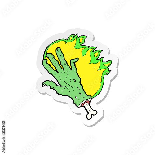 sticker of a cartoon gross flaming zombie hand