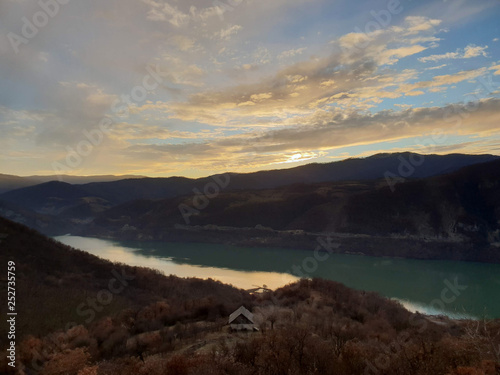 Sunset over the Danube Valley across the two countries Romania and Serbia. The photo was taken from the top of the grand Trescovat cliff.