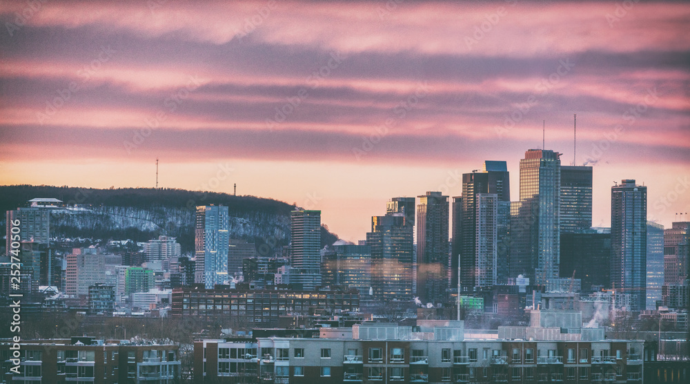 Montreal winter city skyline at dusk night with sunset colorful clouds above Mount Royal. Montreal winter city skyline at dusk night with sunset colorful clouds above Mount Royal.