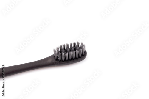 Black Toothbrush without Toothpaste on a White Background