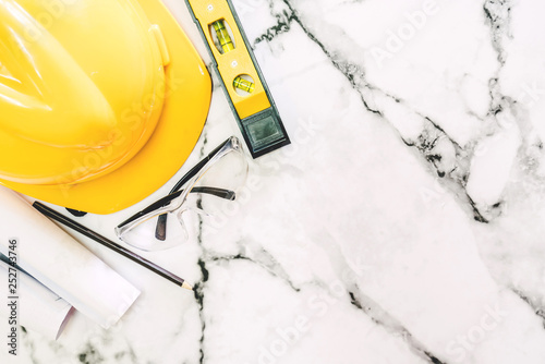 Construction tools with helmet safety on white marble background