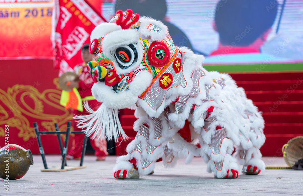 Ho Chi Minh City, Vietnam - December 30th, 2018: Lion dancing competition performing arts welcome new year by Tourism Department of city held 2nd attract visitors to cheer in Ho Chi Minh city, Vietnam