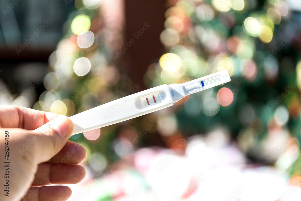 Fototapeta premium Man holding pregnancy test, New life and new family concept