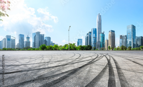 Empty asphalt square ground and city skyline with buildings in Shenzhen