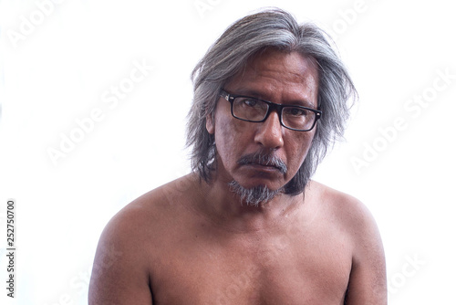 Portrait of homeless or senior man with glasses and no shirt feeling sad and depression in sadness face expression on white Background
