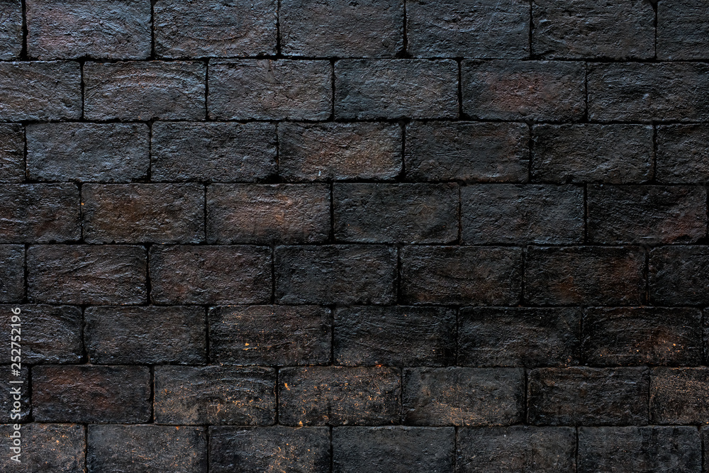 Shiny black brick metallic wall. Abstract pattern background Shiny black brick metallic wall. Abstract pattern background