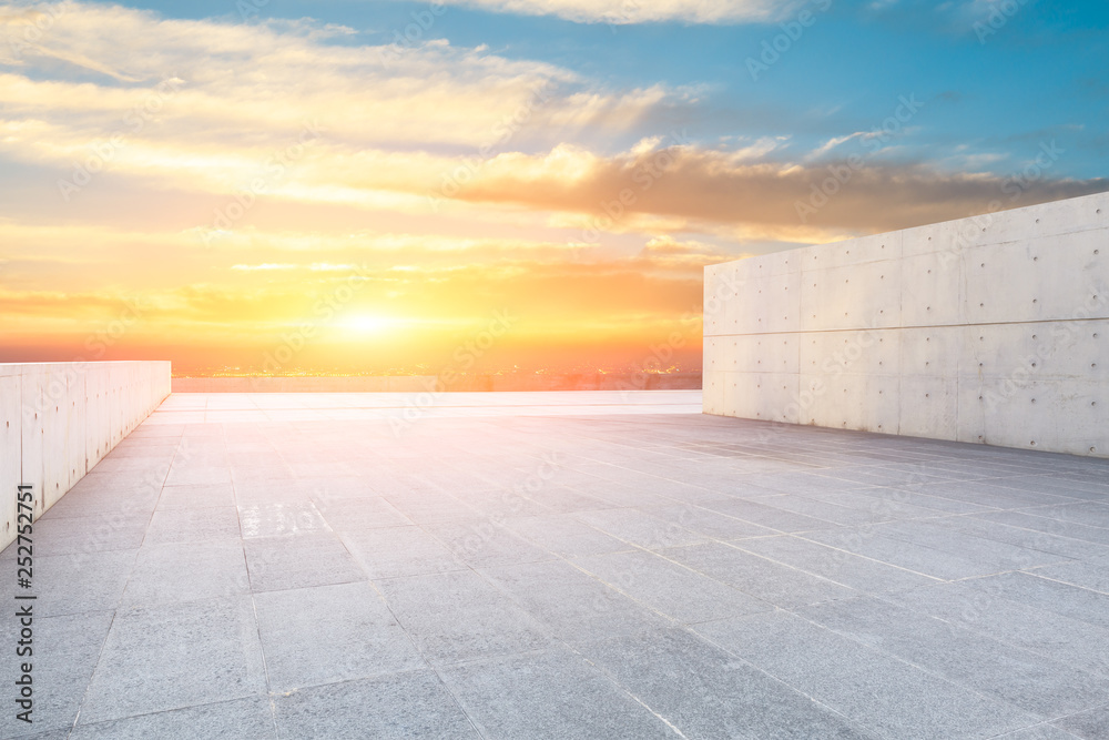 Empty square floor and modern city skyline with beautiful colorful clouds at sunset