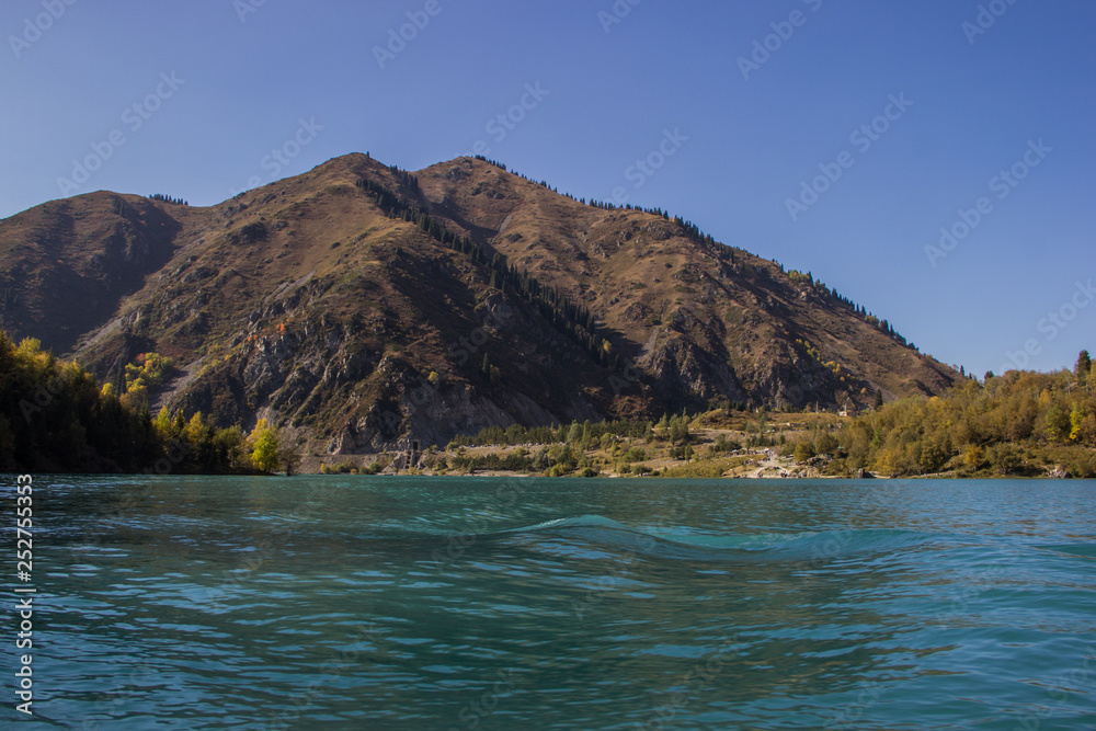 Autumn scenery with mountain behind the lake