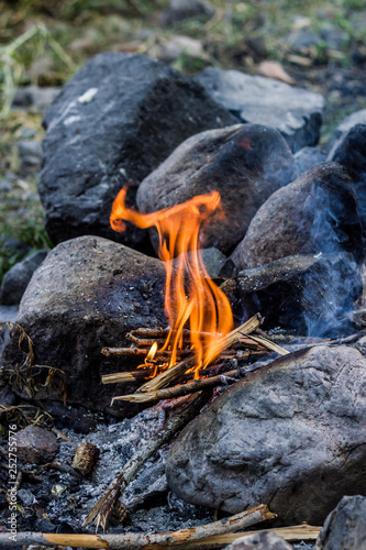 Flame of the bonfire and stones