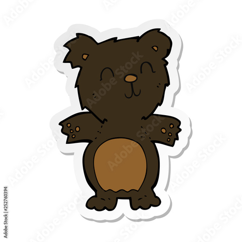 sticker of a cartoon cute black bear cub