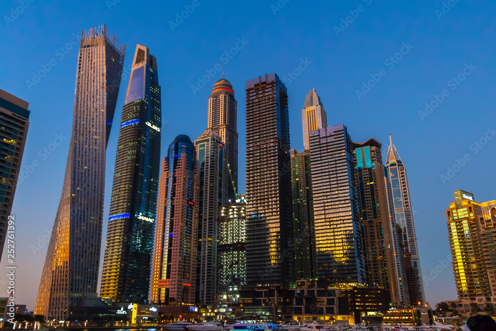 Dubai, UAE - November 29, 2018: High-rise houses of modern futuristic design of Dubai Marina district.