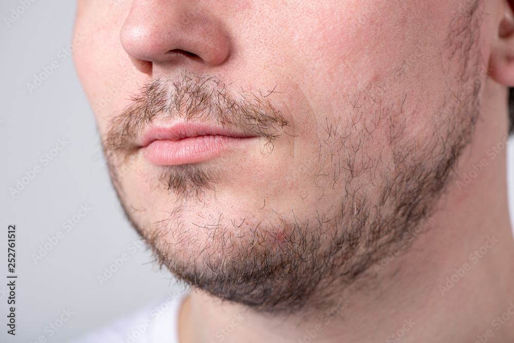 Handsome man with stubble or beard on face close up Handsome man with stubble or beard on face close up
