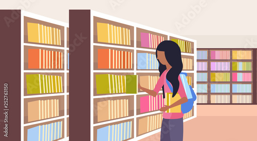 african girl student choosing books schoolgirl near bookshelves modern library interior reading education knowledge concept flat horizontal portrait