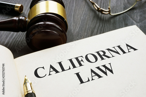 Canvastavla California law on a dark wooden desk.