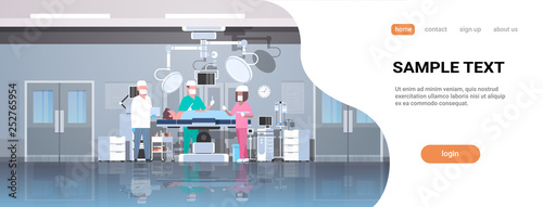 mix race surgeons team surrounding patient lying on operation table during surgery medical workers in operation room modern hospital clinic interior horizontal full length copy space