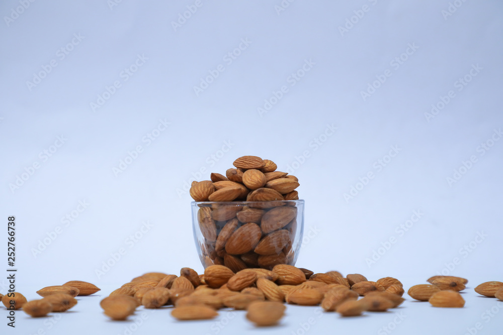 almonds on glass with white background, Indian almonds in white background