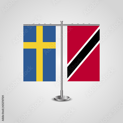Table stand with flags of Sweden and Trinidad and Tobago.Two flag. Flag pole. Symbolizing the cooperation between the two countries. Table flags