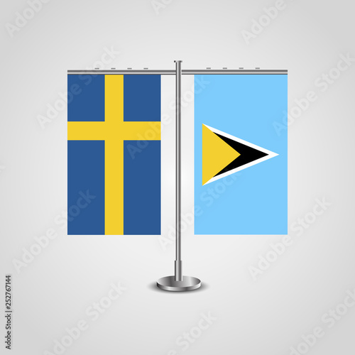 Table stand with flags of Sweden and Saint Lucia.Two flag. Flag pole. Symbolizing the cooperation between the two countries. Table flags