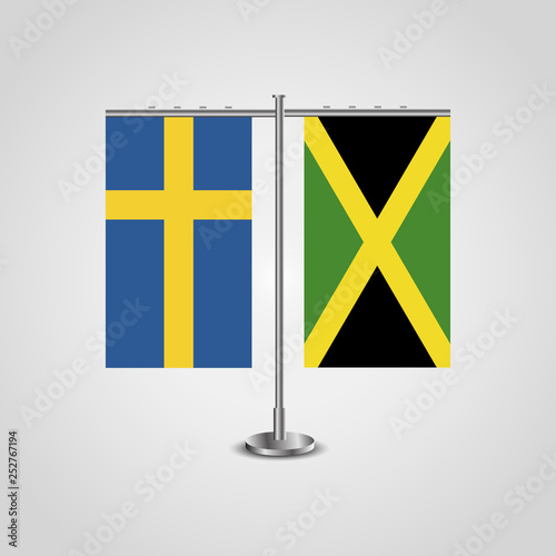 Table stand with flags of Sweden and Jamaica.Two flag. Flag pole. Symbolizing the cooperation between the two countries. Table flags