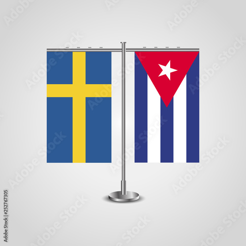 able stand with flags of Sweden and Cuba.Two flag. Flag pole. Symbolizing the cooperation between the two countries. Table flags