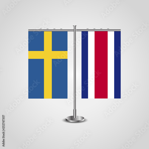 Table stand with flags of Sweden and Costa Rica.Two flag. Flag pole. Symbolizing the cooperation between the two countries. Table flags