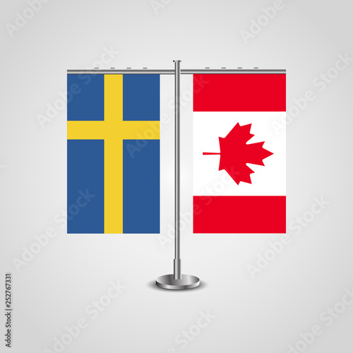 Table stand with flags of Sweden and Canada.Two flag. Flag pole. Symbolizing the cooperation between the two countries. Table flags