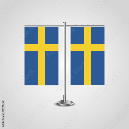 Table stand with flags of Sweden and Sweden.Two flag. Flag pole. Symbolizing the cooperation between the two countries. Table flags