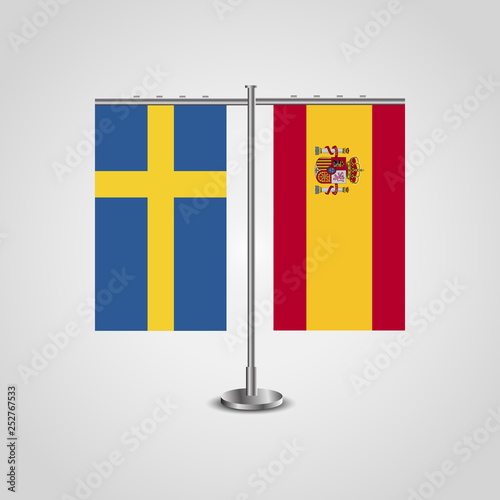 Table stand with flags of Sweden and Spain.Two flag. Flag pole. Symbolizing the cooperation between the two countries. Table flags