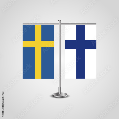 Table stand with flags of Sweden and Finland.Two flag. Flag pole. Symbolizing the cooperation between the two countries. Table flags