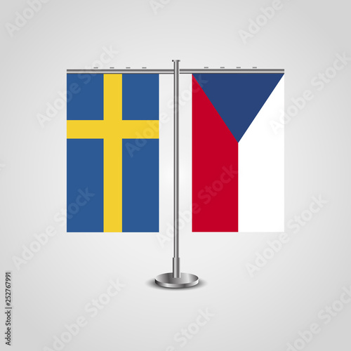 Table stand with flags of Sweden and Czech Republic.Two flag. Flag pole. Symbolizing the cooperation between the two countries. Table flags