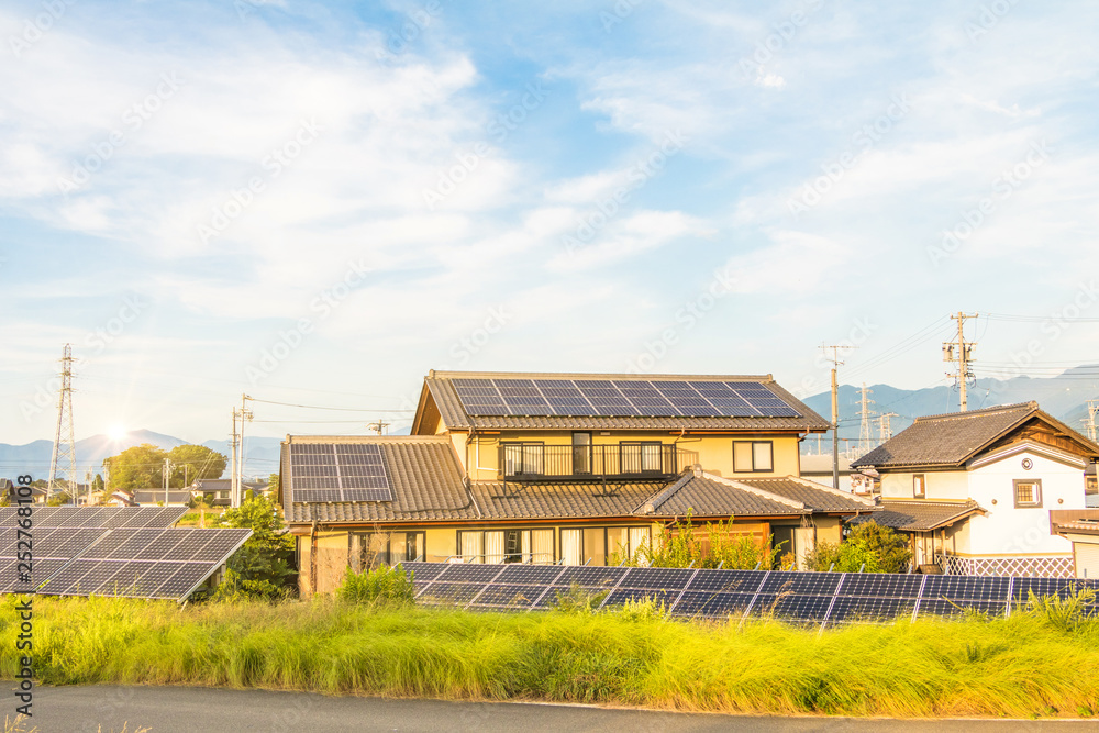Obraz premium Solar power panels for innovation green energy for life with sunrise background.