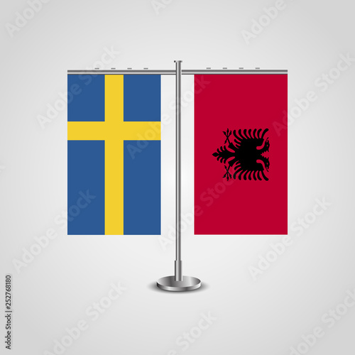 Table stand with flags of Sweden and Albania.Two flag. Flag pole. Symbolizing the cooperation between the two countries. Table flags