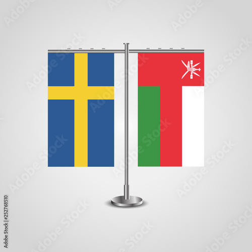 Table stand with flags of Sweden and Oman.Two flag. Flag pole. Symbolizing the cooperation between the two countries. Table flags