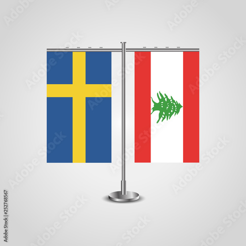 Table stand with flags of Sweden and Lebanon.Two flag. Flag pole. Symbolizing the cooperation between the two countries. Table flags