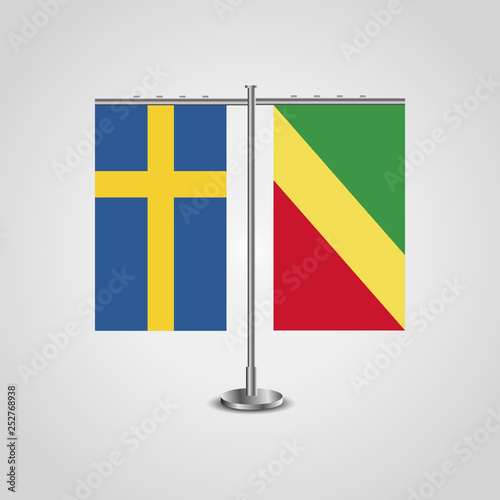 Table stand with flags of Sweden and Republic of the Congo.Two flag. Flag pole. Symbolizing the cooperation between the two countries. Table flags