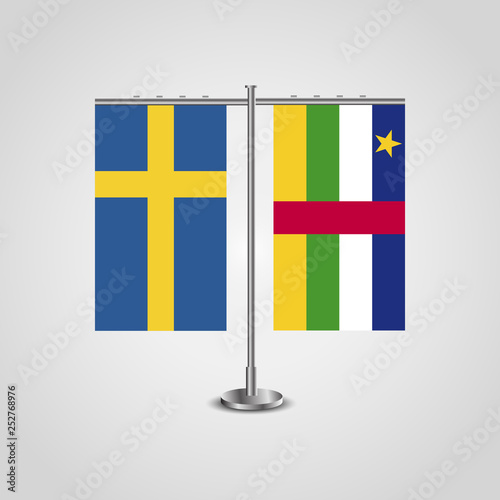 Table stand with flags of Sweden and Central African Republic.Two flag. Flag pole. Symbolizing the cooperation between the two countries. Table flags