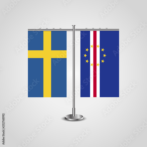 Table stand with flags of Sweden and Cape Verde.Two flag. Flag pole. Symbolizing the cooperation between the two countries. Table flags
