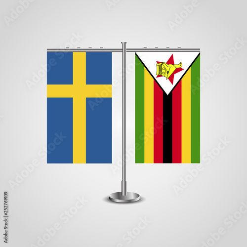 Table stand with flags of Sweden and Zimbabwe.Two flag. Flag pole. Symbolizing the cooperation between the two countries. Table flags