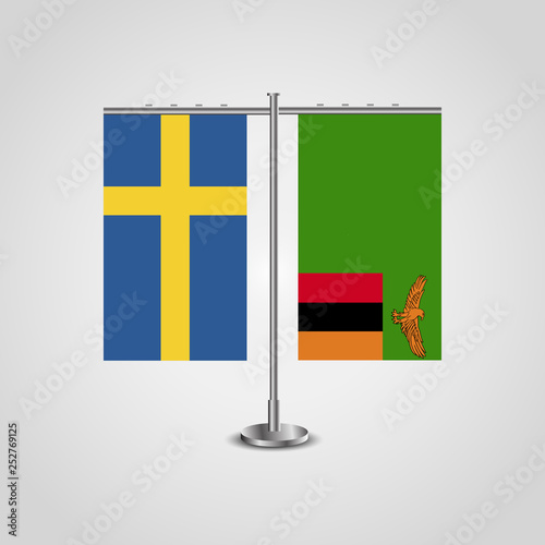 Table stand with flags of Sweden and Zambia.Two flag. Flag pole. Symbolizing the cooperation between the two countries. Table flags