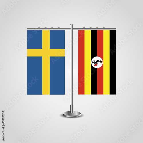 Table stand with flags of Sweden and Uganda.Two flag. Flag pole. Symbolizing the cooperation between the two countries. Table flags